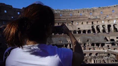 Tourist making video with smartphone inside the Colosseum, Rome, Italy Stock Footage 77738437
