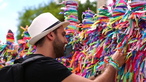 Tourist Making a Wish in Bonfim Church, Salvador, Bahia, Brazil Stock Footage