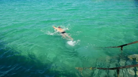 Tourist male vacationer swims and dives in Red Sea, Egypt  Video stock 59677251