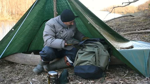 Tourist man gets things out of backpack Video stock 101318583
