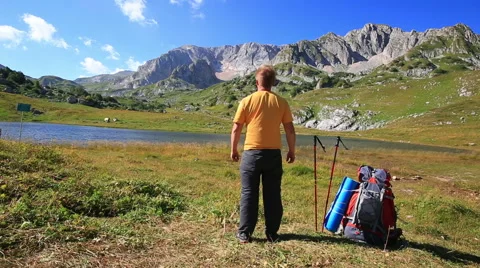 Tourist man in mountain with backpack Stock Footage 53849231