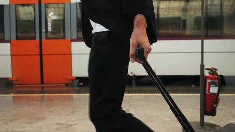 Tourist man with suitcase baggage in spain, A traveler with luggage suit jacket Stock Footage 288115514