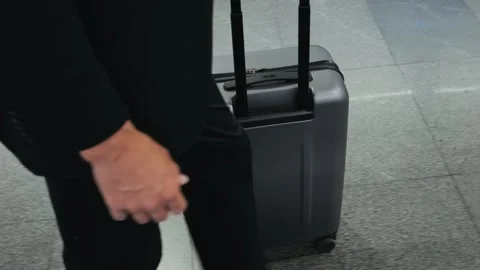 Tourist man with suitcase baggage in spain, A traveler with luggage suit jacket Stock Footage 288115637