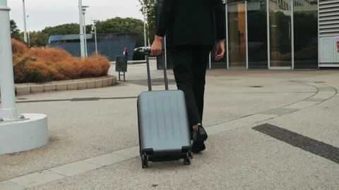 Tourist man with suitcase baggage in spain, A traveler with luggage suit jacket Stock Footage 288115878