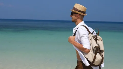 Tourist Man Walking With Backpack On Beach By The Sea On Summer Holidays Stock Footage 86794149