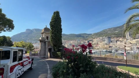 Tourist Mini Train Passing on Road Monaco - Cityscape View Stock Footage 346565111