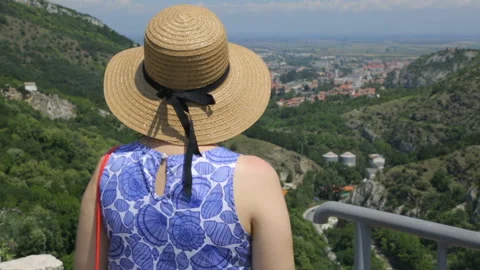 Tourist on mountain looking down Stock Footage 96124740