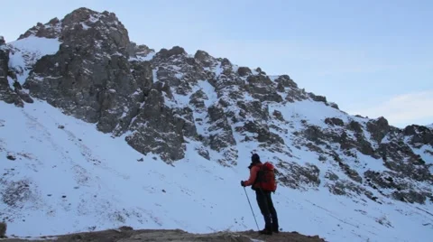 Tourist in the mountains in winter Stock Footage 60086337