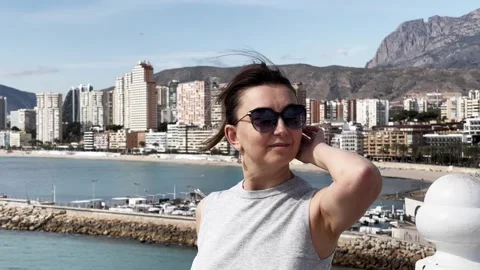 Tourist observing Benidorm skyline Stock Footage 303428557
