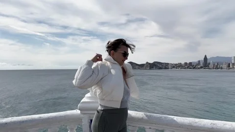 Tourist observing Benidorm skyline Stock Footage 303428559