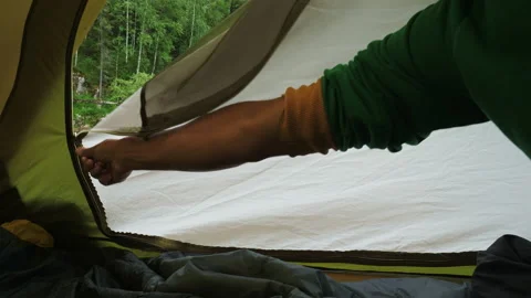 The tourist opens the tent from the inside Video stock 194381639