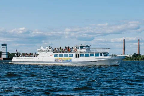 A tourist or excursion ship is sailing in the waters of the Gulf of Finland Stock Photos