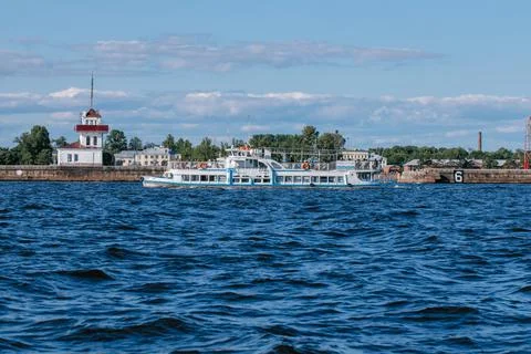 A tourist or excursion ship sails in the waters of the Gulf of Finland to the Stock Photos