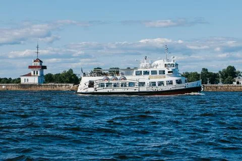 A tourist or excursion ship sails in the waters of the Gulf of Finland to the Stock Photos