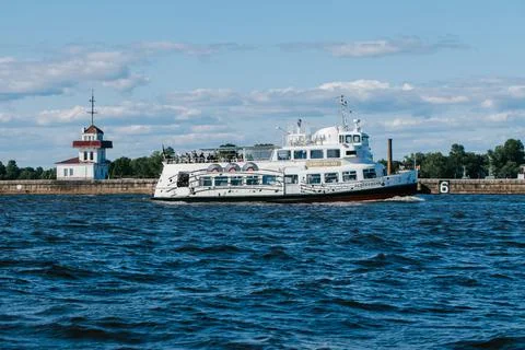 A tourist or excursion ship sails in the waters of the Gulf of Finland to the Stock Photos