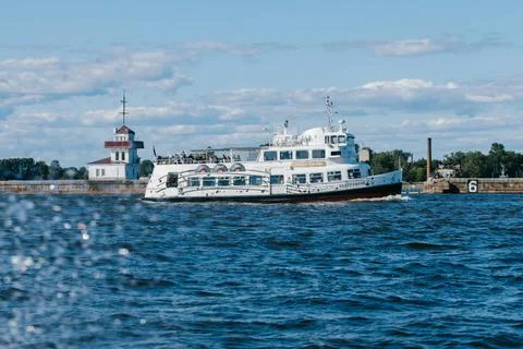 A tourist or excursion ship sails in the waters of the Gulf of Finland to the Stock Photos