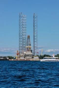 A tourist or excursion ship sails in the waters of the Gulf of Finland against 스톡 사진