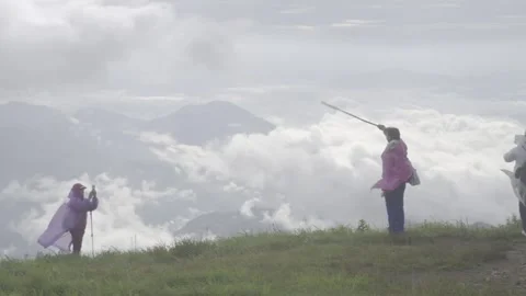 Tourist Overlooking Sea of Clouds at Summit May 8 2026 Stock-Footage 343665856