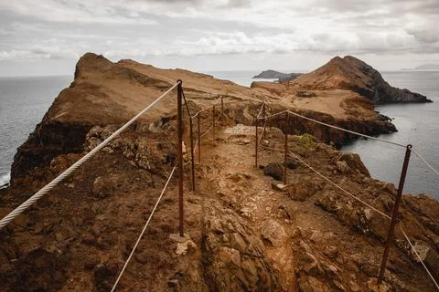 Tourist Path in the mountains through the cliffs, Portugal, Madeira. Stock Photos