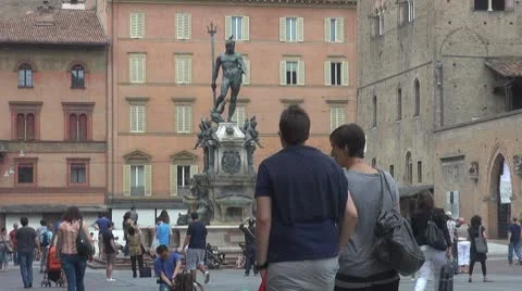 Tourist people enjoy Fountain Neptune Bologna Italy tourism attraction emblem Stock Footage