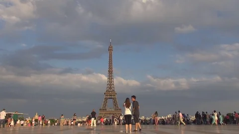 Tourist people visit Eiffel tower landmark in Paris busy Trocadero square by day Stock Footage 84733982