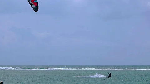 Tourist Performs Amazing Leap while Kitesurfing off Balinese Tropical Beach 库存影片 71872030