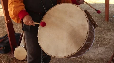 Tourist is Playing on Old Ancient Drum During Historical Reenactment Stock Footage 58443365