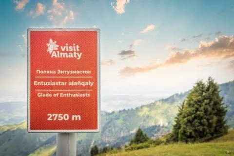 Tourist pointer - Visit Almaty - Glade of Enthusiasts indicating the height in Stock Photos