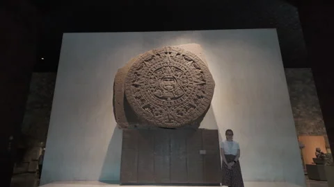 Tourist posing by Aztec Sun Stone at Museum of Anthropology in Mexico City. Stock Footage 319118165