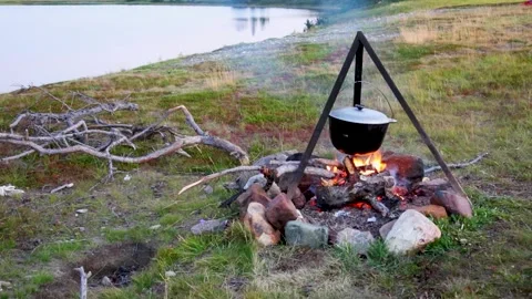 Tourist pot on the fire Stock Footage 305188014