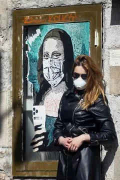 Tourist with protections mask visits Barcelona, Spain - 09 Mar 2020 Stock Photos