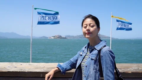 Tourist relaxing on seaside looking around Video stock 98475853