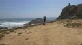 Tourist resting on the beach near Porto 4k or 4k+ Resolution