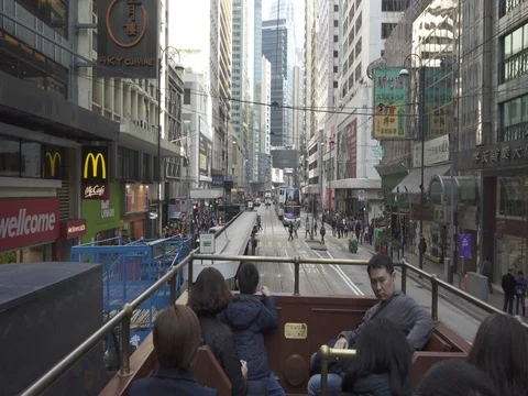Tourist riding an Open deck Tram  in Hong Kong. Video stock 72153151