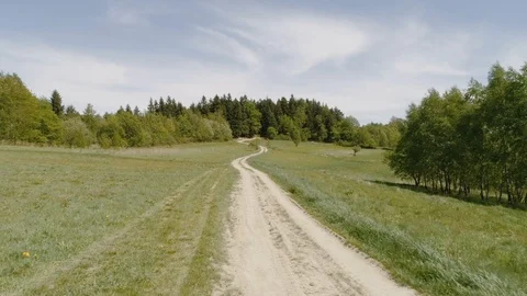 Tourist route surrounded by fields and forests at Beskids mountain range in Stock Footage 122282222