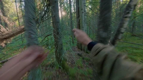 A tourist is running away from danger in the forest, fearing for his life. Video stock 342002000