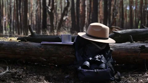 Tourist s backpack, binoculars, a map and equipment for a hike Stock-Footage 150259978