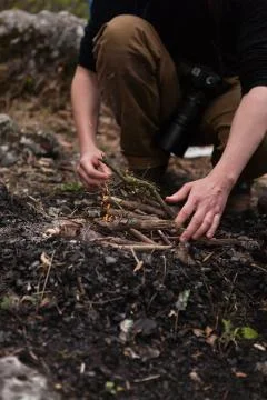 Tourist is setting campfire Stock Photos