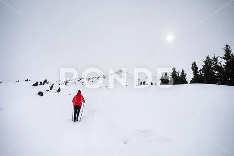 Tourist in the snowy mountains Stock Photos
