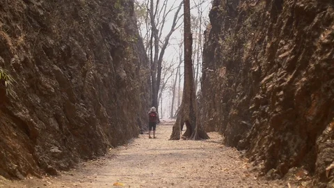 Tourist standing in Hellfire pass remembering soilder lost here at moutain Stock Footage 103042171