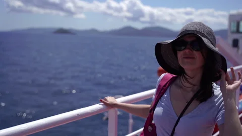 A tourist stands on the deck and sails to Elba Island. Stock Footage 329005708