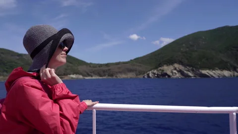 A tourist stands on the deck and sails to Elba Island. Stock Footage 329006573