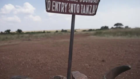 Tourist stop border sign between Kenya and Tanzania African country line Video stock 339968460