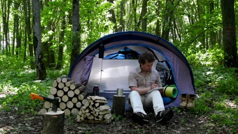 Tourist Takes Notes In A Notebook. Stock Footage 98491396