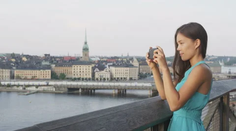 Tourist taking photo using smart phone Stockholm skyline and Gamla Stan Stock Footage 50164328