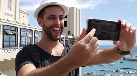 Tourist taking a selfie in Lacerda Elevator, Salvador, Bahia, Brazil Stock Footage 62840037