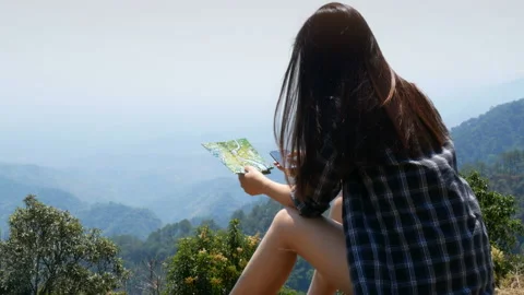 Tourist use application touching on smartphone and map for search information Stock-Footage 135983579