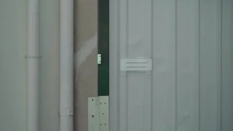 Tourist Using Access Control Button to Open Exit Gate Stock Footage 340415146