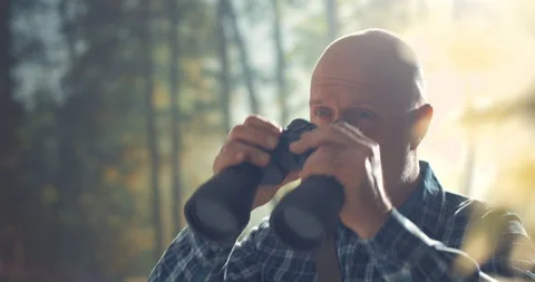 Tourist using binoculars and observing wildlife Stock Footage 151158231