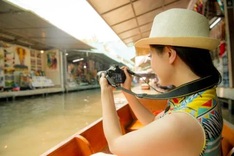 Tourist using camera recording local vendor view 스톡 사진